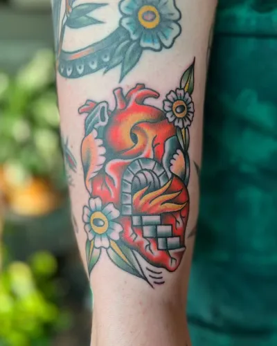 Black and grey tattoo of a lion wearing a crown of thorns, by Chay Menke at Ministry Ink