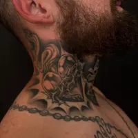 Black and grey ornamental neck and throat piece — by Chay Menke