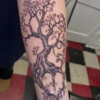 Fine line blossoming tree with delicate branches on a forearm — by Gabriel Gonzalez